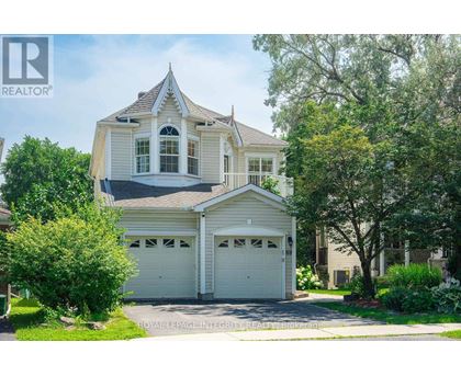 A house with a white garage door is for sale.