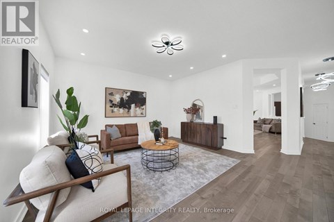 A modern living room with a white sofa and a coffee table.
