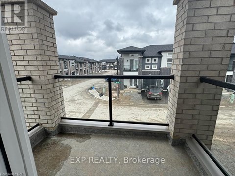 A view from a balcony of a building with the text "EXP REALTY, Brokerage" on the railing.