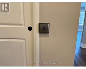 A brokerage sign is on the door.