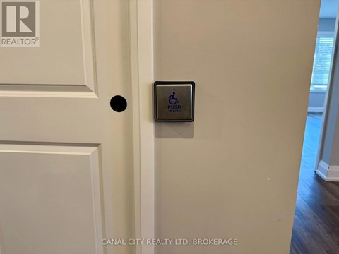 A brokerage sign is on the door.
