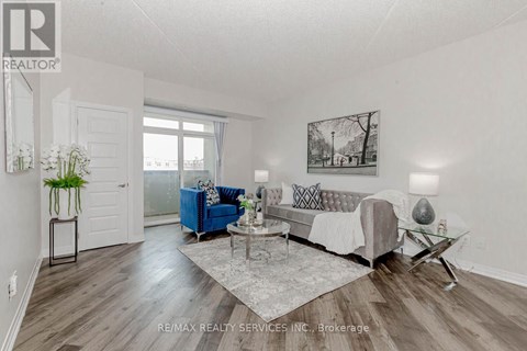 A living room with a blue couch and a coffee table.