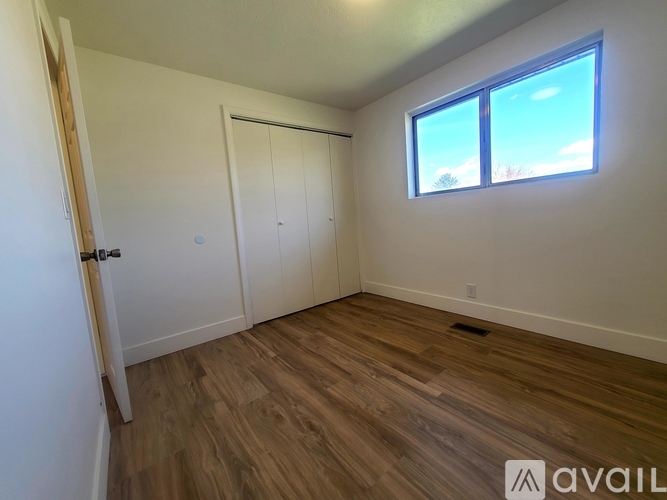 A room with a sliding door and a window.
