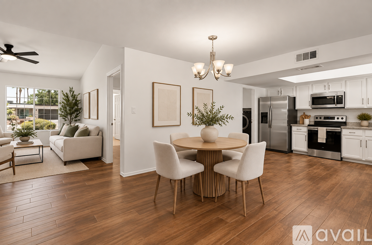 A modern kitchen with a dining table and chairs.