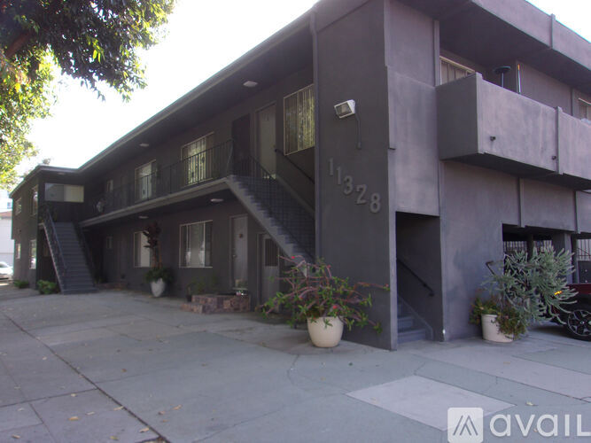 A grey building with the number 11328 on it.