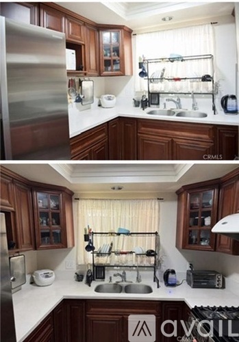 A room with wooden flooring and a window.