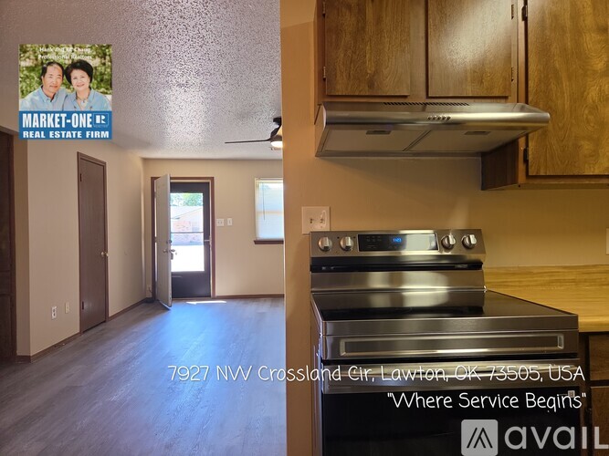 A real estate firm's advertisement featuring a kitchen with a stove and a doorway leading to another room.