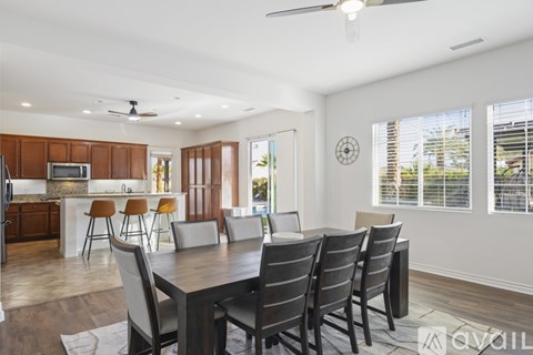 A dining room with a table and chairs is shown.
