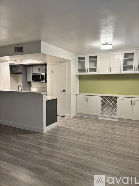 A kitchen with a counter and cabinets.