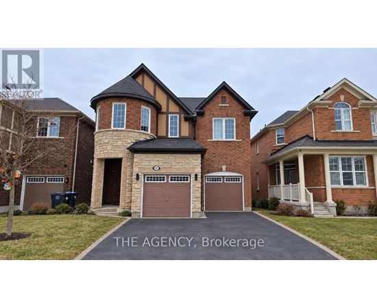 A large brick house with a sign that says "The Agency Brokerage".