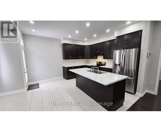 A modern kitchen with a large island in the middle.