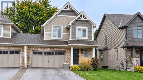 A large, two-story house with a garage is shown.