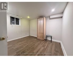 A room with a wooden floor and a small table.