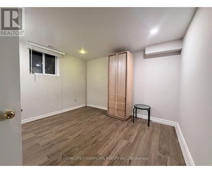 A room with a wooden floor and a small table.
