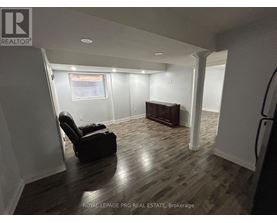 A room with a chair and a desk in it.
