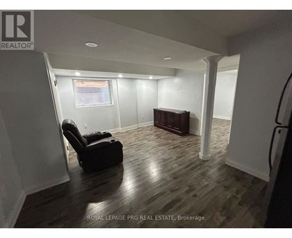 A room with a chair and a desk in it.