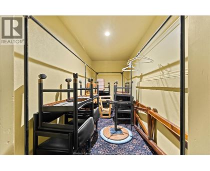 A bedroom with bunk beds and a desk.