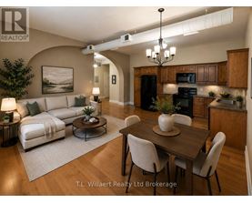 A well-lit, modern kitchen and living room with a dining area.