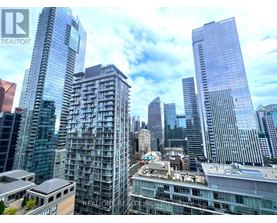 A cityscape with skyscrapers and a building with the text "REALONE REALTOR" on it.