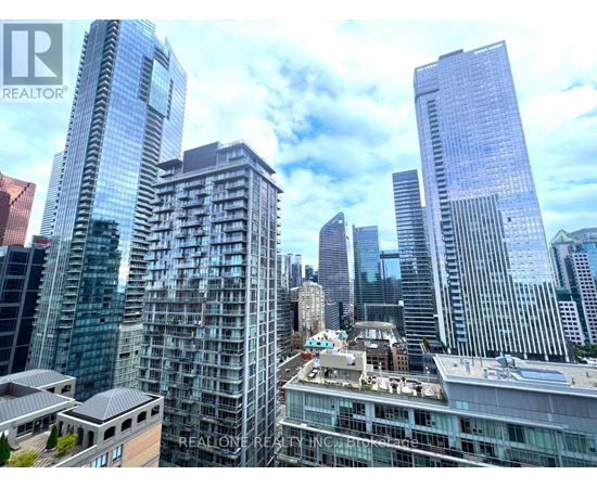 A cityscape with skyscrapers and a building with the text "REALONE REALTOR" on it.