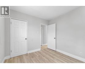 A white door is on the left and an open white door is on the right.