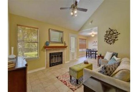 A living room with a fireplace and a couch.