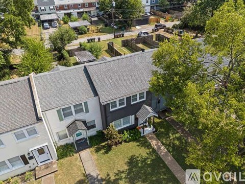 A bird's eye view of a residential area with houses and trees.