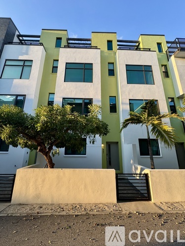 A modern building with a tree in front of it.