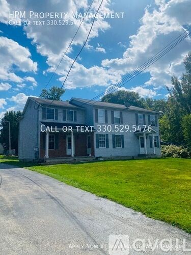 A house with a sign that says "HPM PROPERTY MANAGEMENT" is for sale.