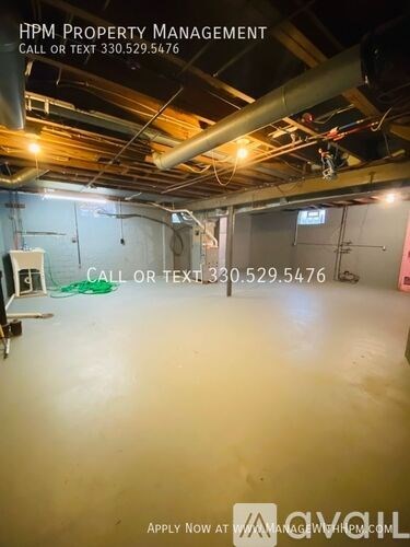 An empty warehouse space is available for rent.