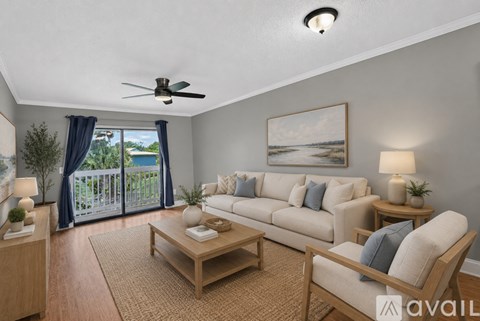 A living room with a sofa set, a coffee table, and a ceiling fan.