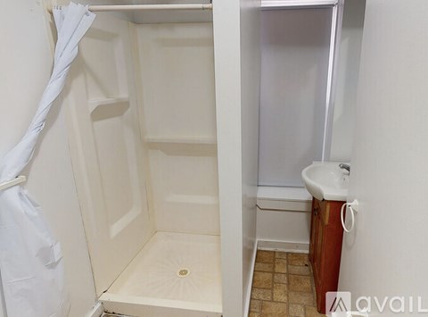 A small bathroom with a toilet and a sink.
