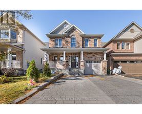 A large house with a driveway in front of it.