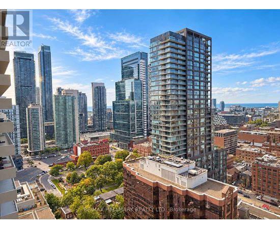 A cityscape with tall buildings and a clear sky.