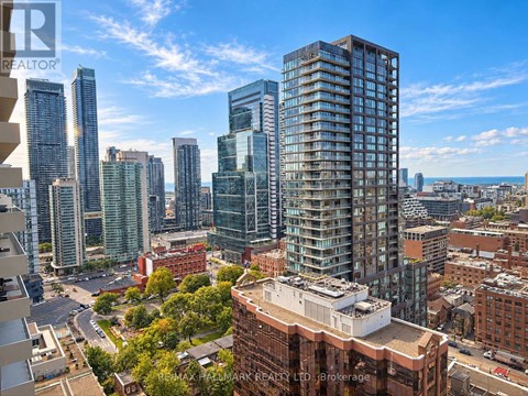 A cityscape with tall buildings and a clear sky.