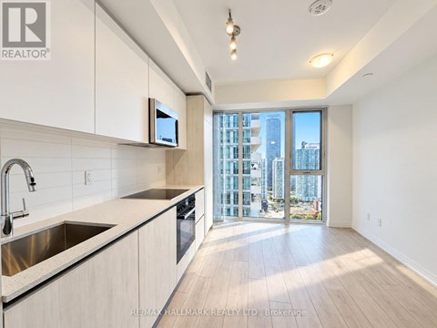 A modern kitchen with a view of the city.