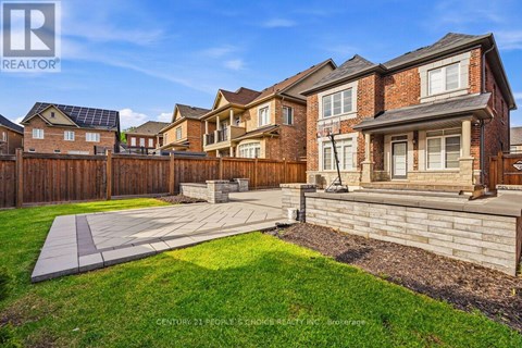 A sunny day in a suburban neighborhood with a house and a yard.