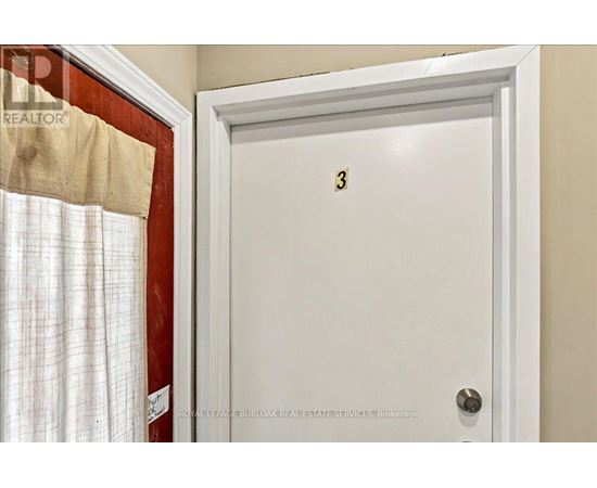 A white door with the number 3 on it.