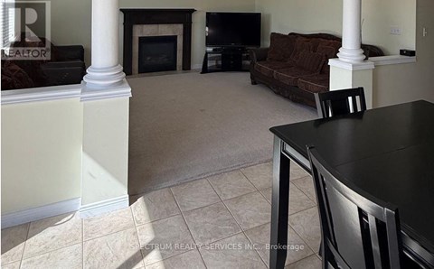 A living room with a fireplace and a couch.