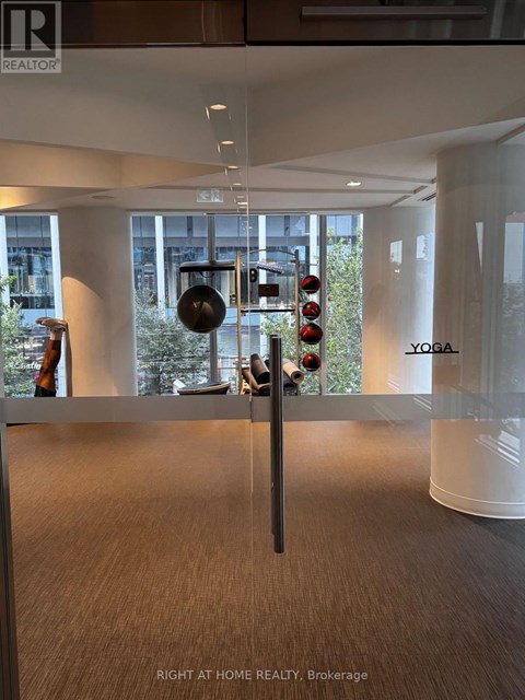 A yoga studio is located in the Brokerage of a real estate office.