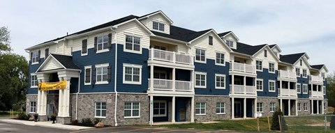 A large building with a blue and white exterior.