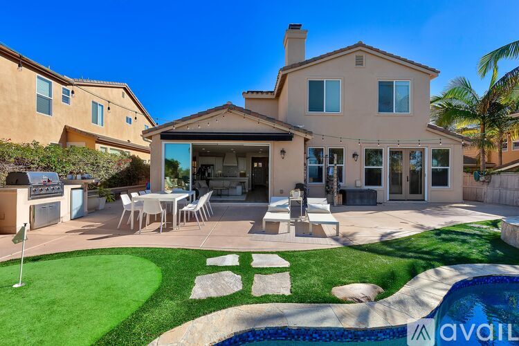 A house with a pool in the backyard.