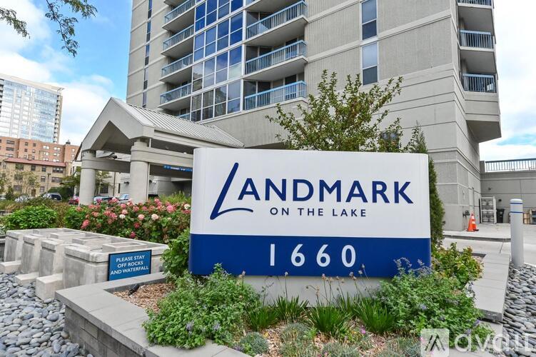A sign for Landmark on the Lake 1660 in front of a building.