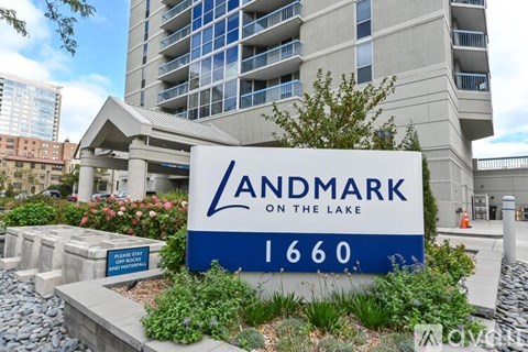 A sign for Landmark on the Lake 1660 in front of a building.