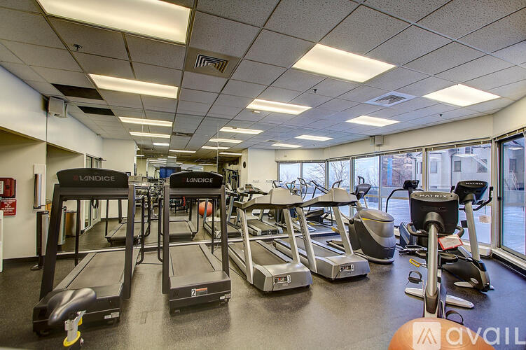A gym with treadmills and exercise bikes.