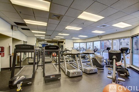 A gym with treadmills and exercise bikes.