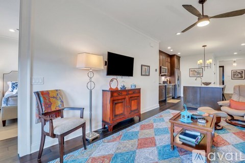 A living room with a wooden chair and a wooden cabinet.