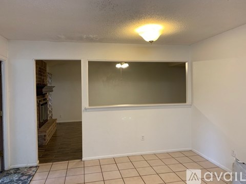 A room with a white ceiling and a large window.