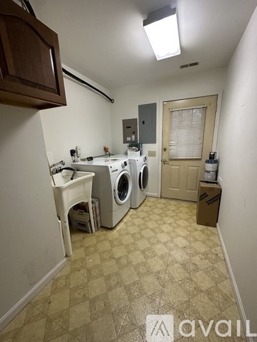 A laundry room with a washer and dryer.