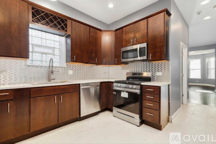 A kitchen with brown cabinets and a white countertop.